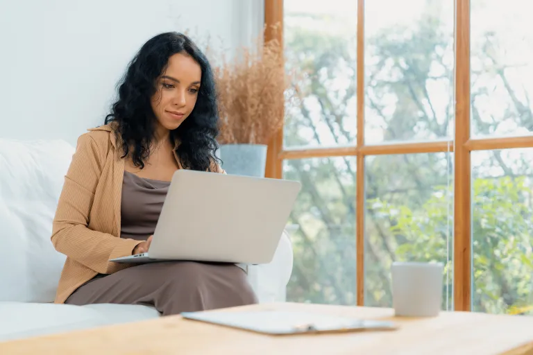 A woman looking up HSA eligibility requirements.