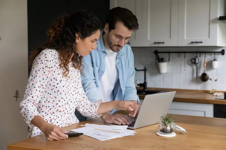 A couple reviews a portfolio with I Bond investments.