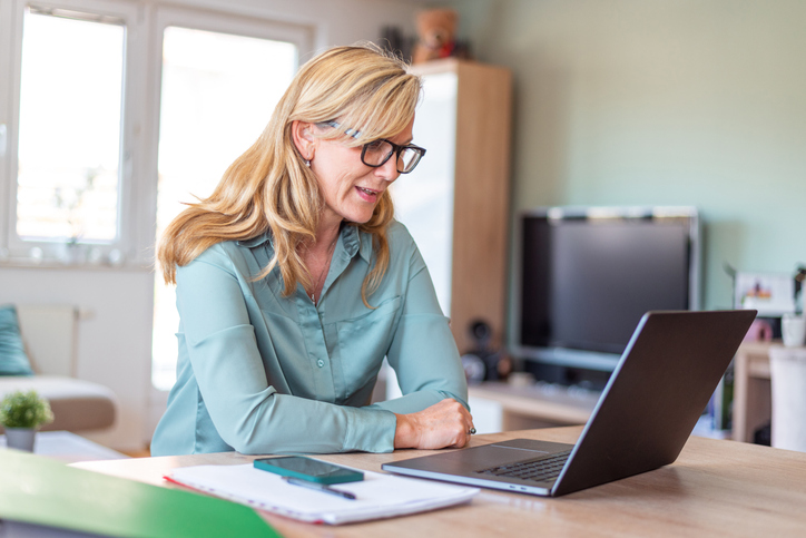 A woman consulting an estate planning attorney in a video meeting.