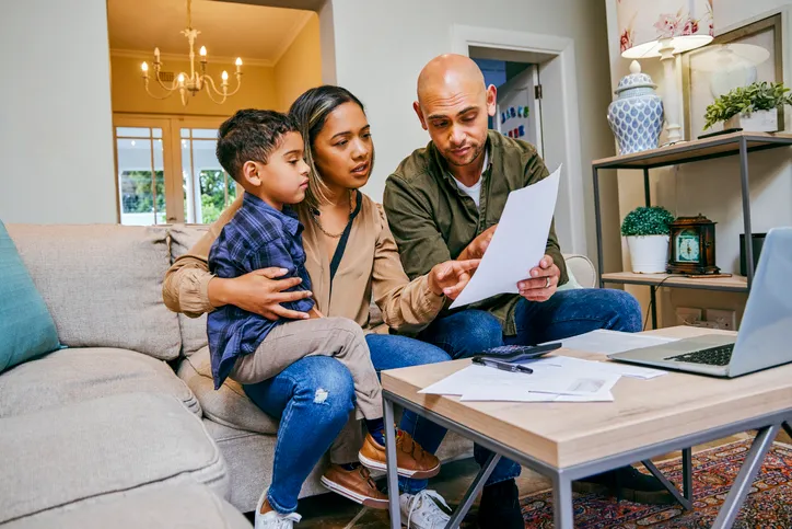 Parents reviewing tax documents.