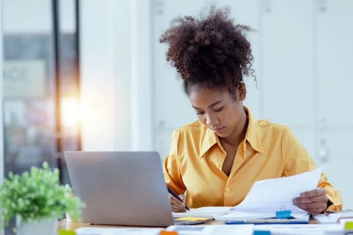 A woman reviewing her financial plan.