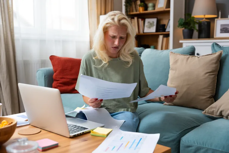 A woman reviewing her retirement plan contributions.