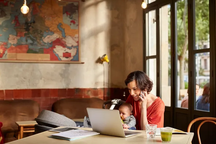 A mother consulting a tax expert over the phone.