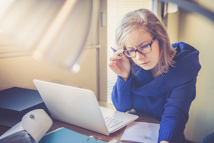 An investor reviewing her investment portfolio.