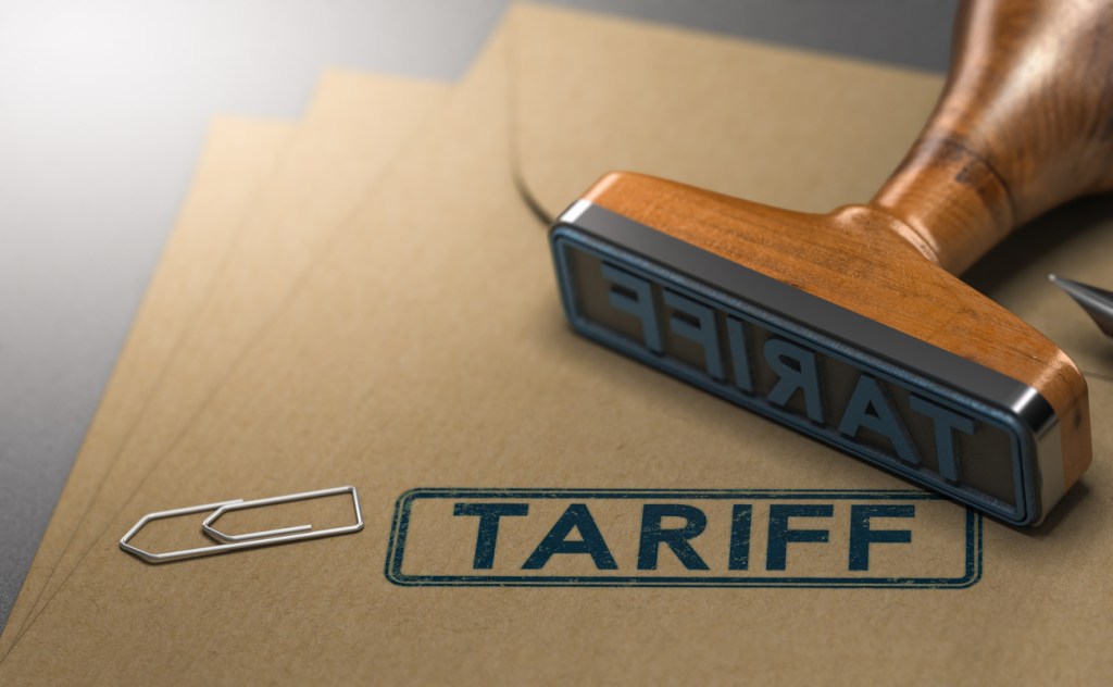 A close-up of a rubber stamp of the word tariff.