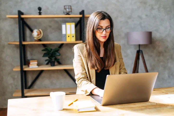 A woman researching how the reserve ratio could affect interests on loans.