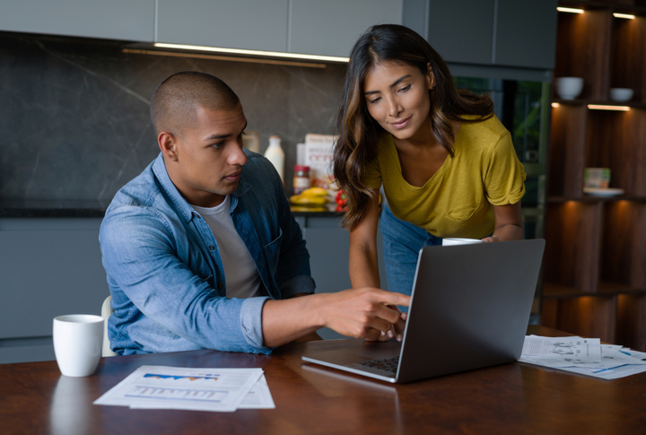 A couple reviewing their investments.