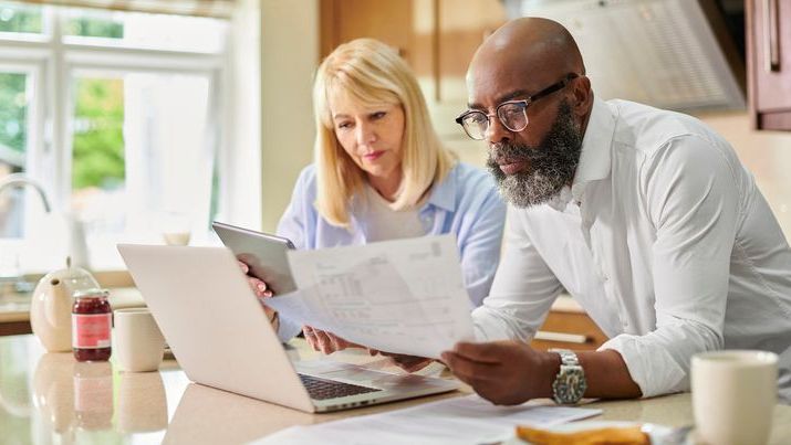 A married couple reviews their finances together.