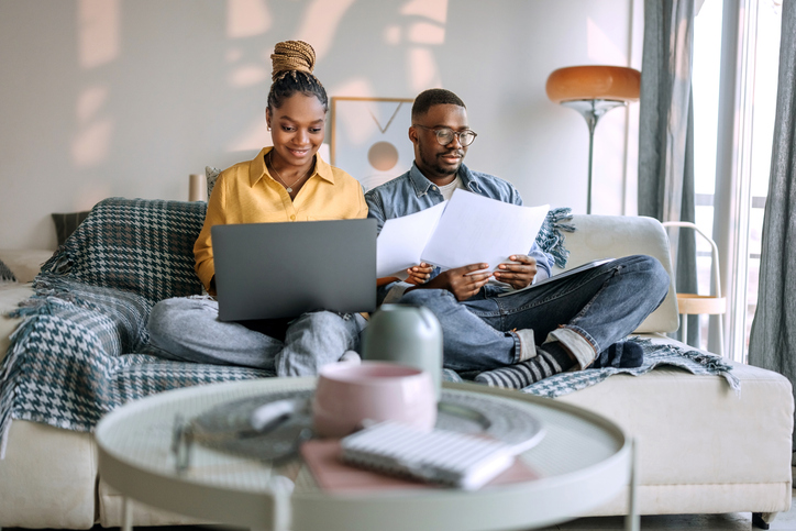 Homeowners reviewing documents before the appraisal of a home.