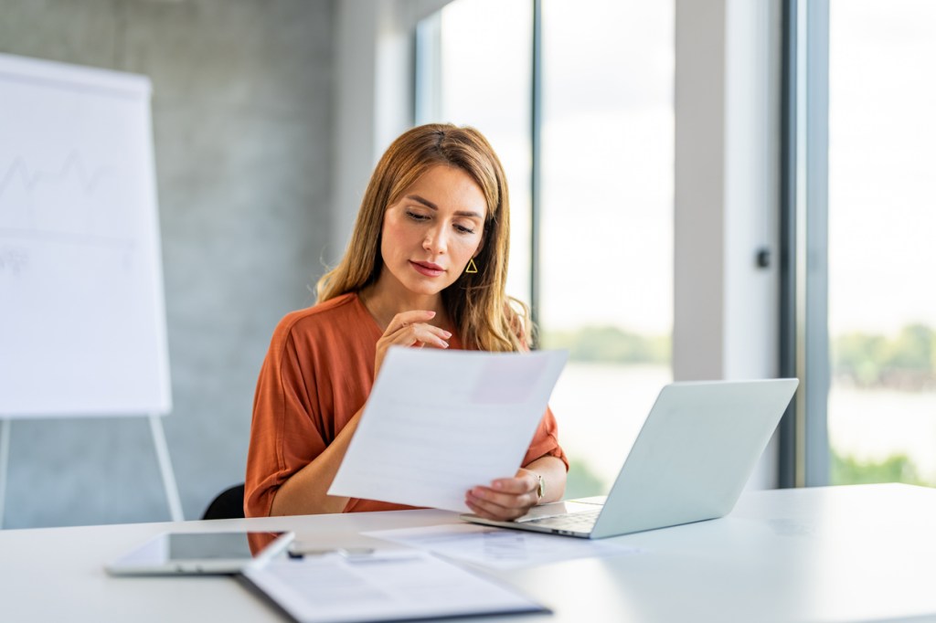 A woman reviewing her taxes.