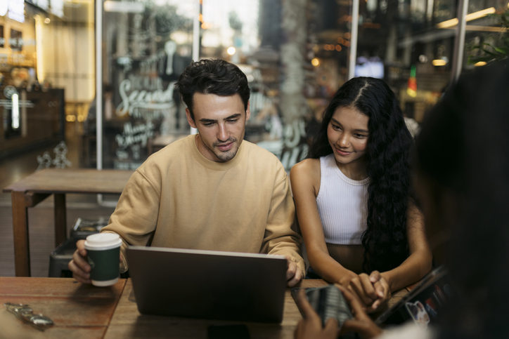 A couple reviewing their portfolio.