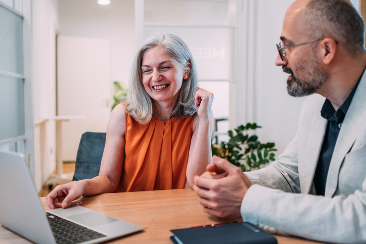 An independent financial advisor reviewing a portfolio with a client.