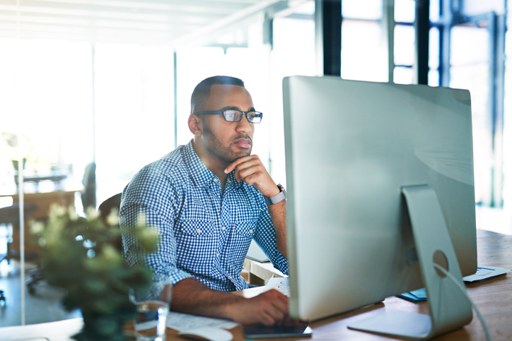 An investor looking up the differences between tariffs and other types of taxes.