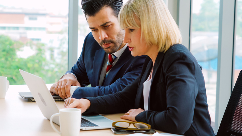 Two business owners creating a plan for their business.