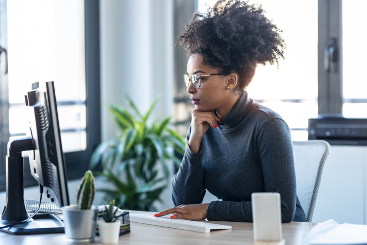 A woman researching whether tariffs generate tax revenue.