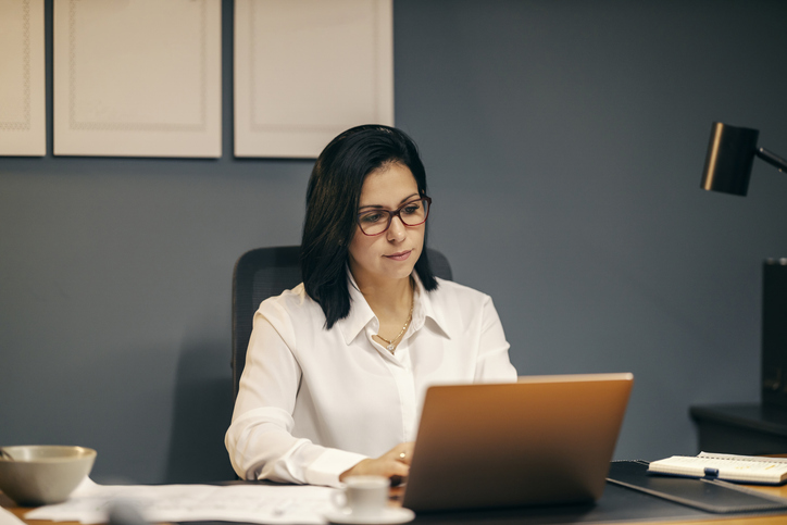 An investor reviewing her investment portfolio.