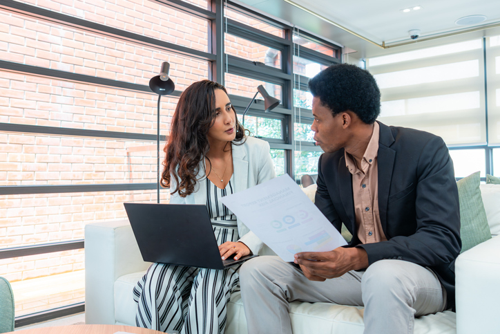 A couple reviewing their investment objectives.