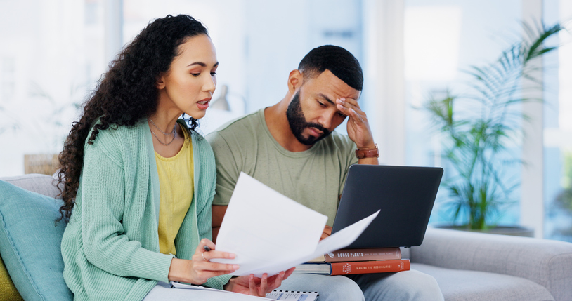 A divorced couple reviewing their finances. 
