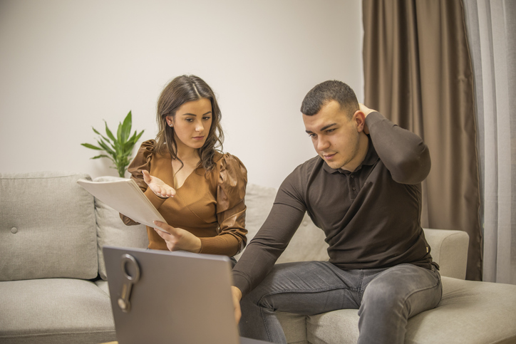 A couple reviewing differences between tariffs and duties.