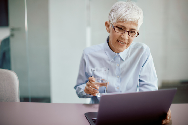 A woman researching common types of indirect taxes.