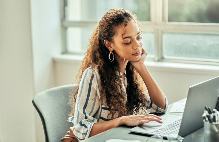 An investor weighing the pros and cons of a bear call spread strategy.