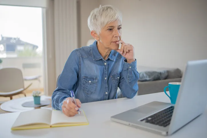 A woman researching what she will have to do after missing an RMD.