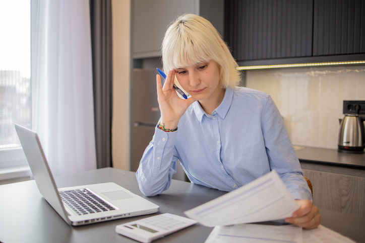 A woman comparing different retirement savings strategies.