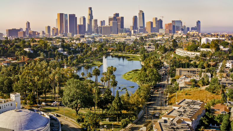 Aerial view of Echo Park Lake surrounded by high rise office buildings in the City Of Los Angeles, California.

