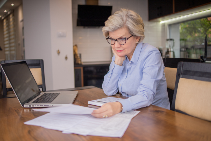 A woman reviewing documents for an annuity.