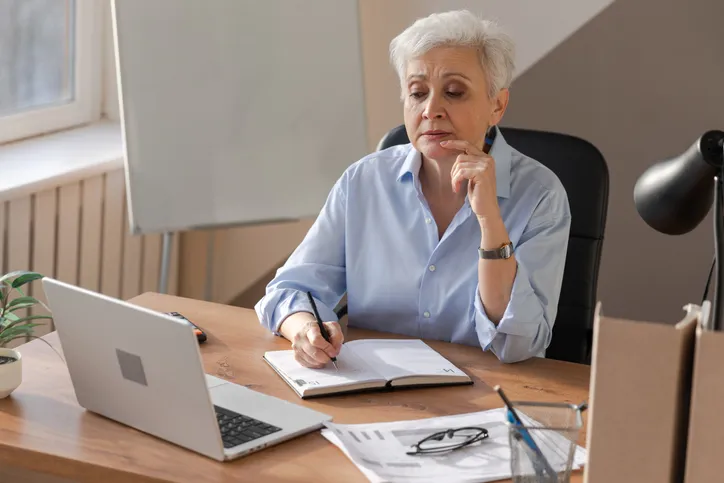 A senior making adjustments to her retirement plan.