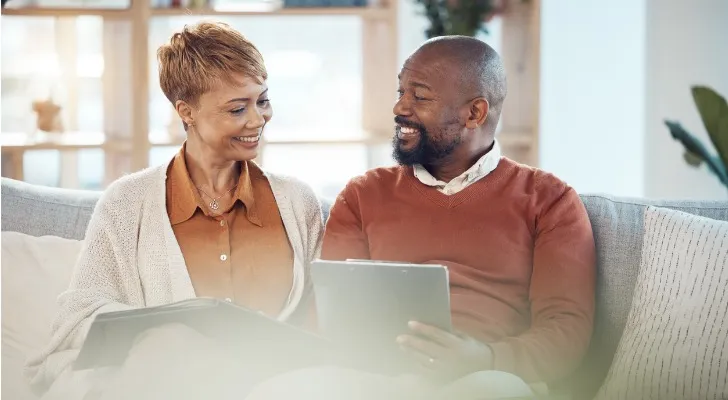 A couple reviews their retirement goals together. 