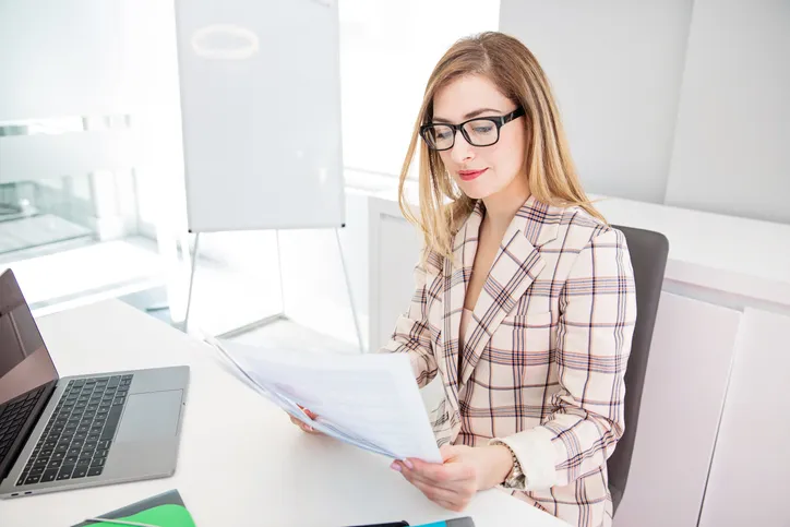 A real estate owner reviews tax documents for rental income.