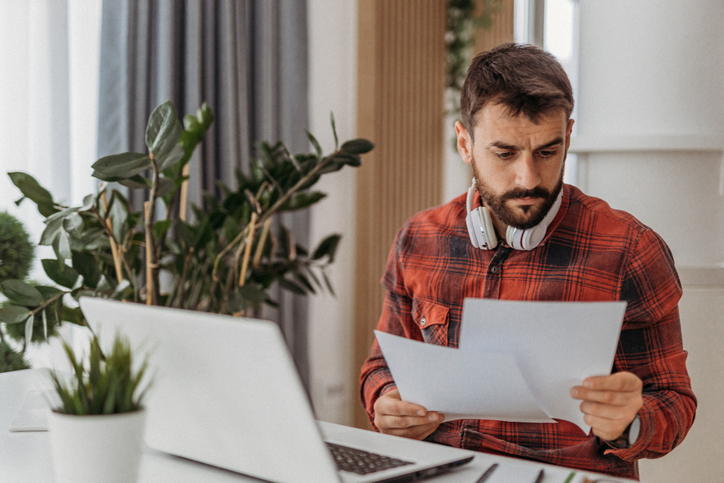 A man reviewing phaseout thresholds for AMT exemptions.