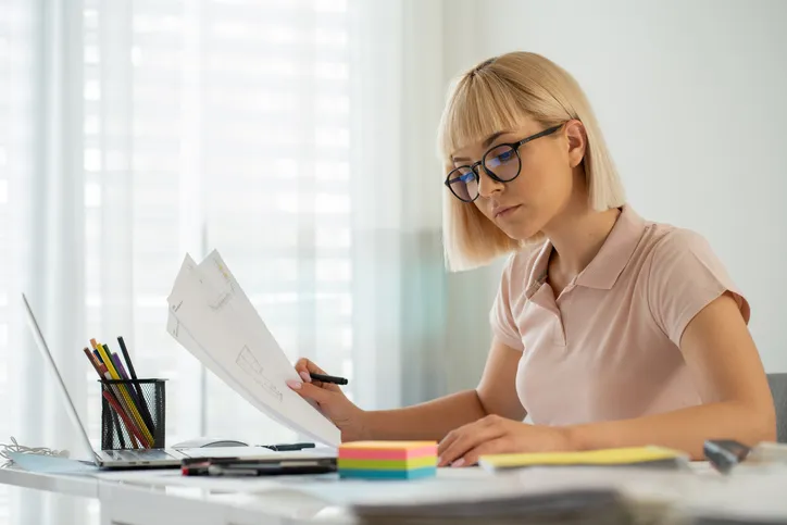 A woman preparing her taxes.