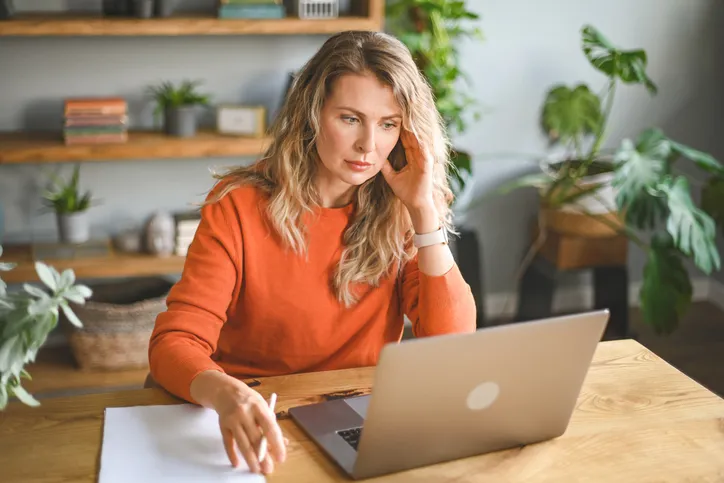 A woman looking up property taxes for her home.