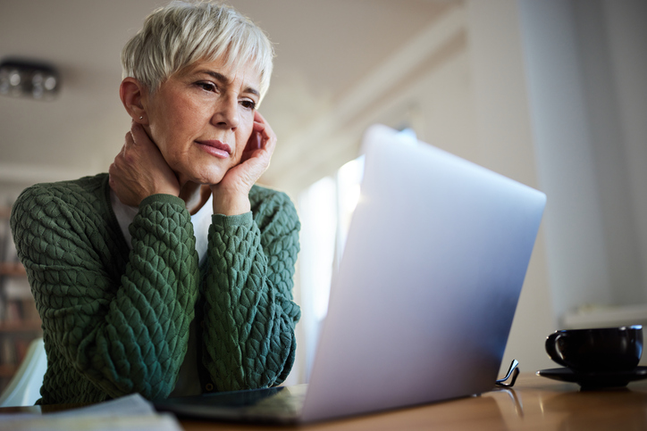 A woman researching how profits are distributed in a partnership.