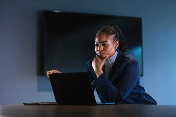 A woman considering whether she should take a loan from her 401(k).