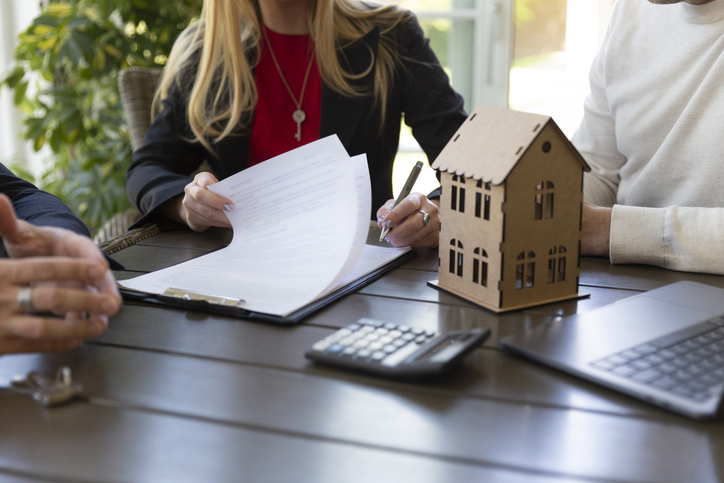Estate planner and clients discuss how to put a house in a trust with a mortgage.