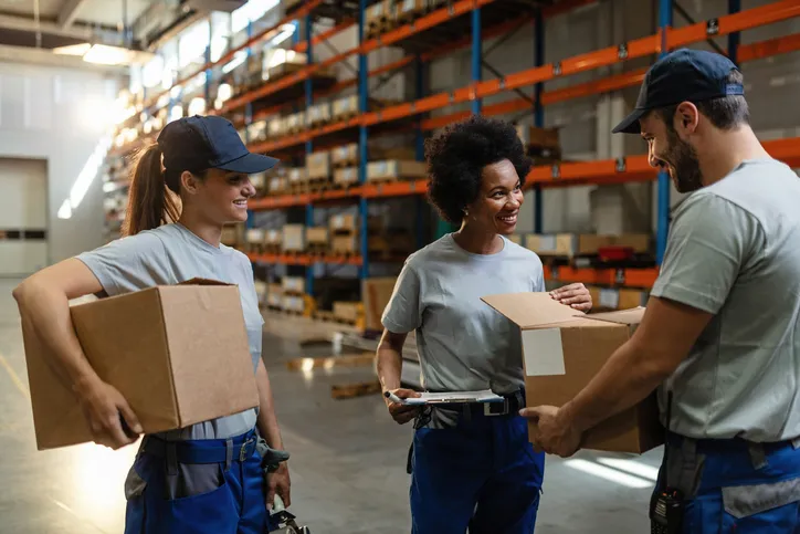 Warehouse workers discussing an order.