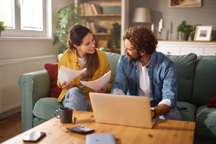 A couple seeing if they qualify for an FHA loan.