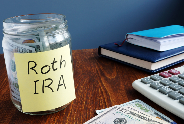 A jar of money labeled "Roth IRA."