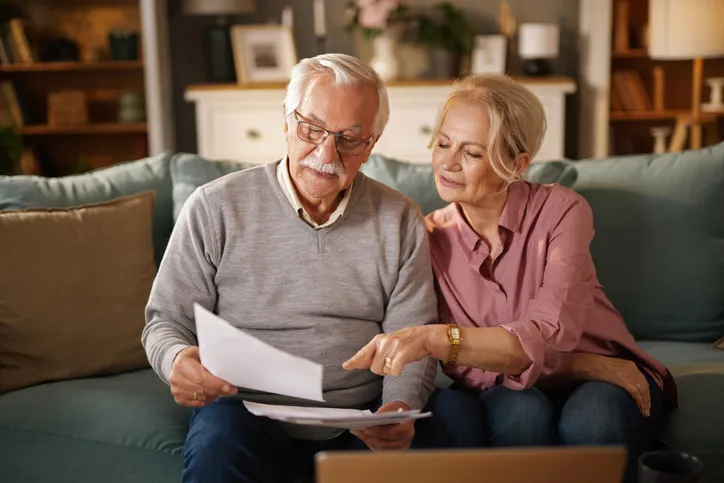 A couple going over how to invest their inheritance.