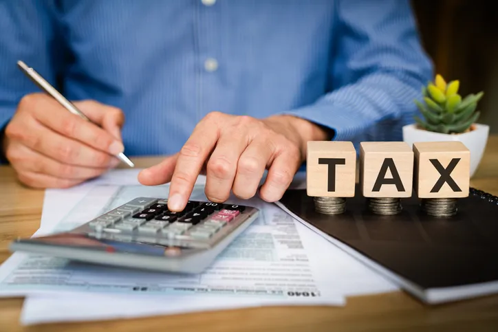 An investor calculating capital gains taxes.