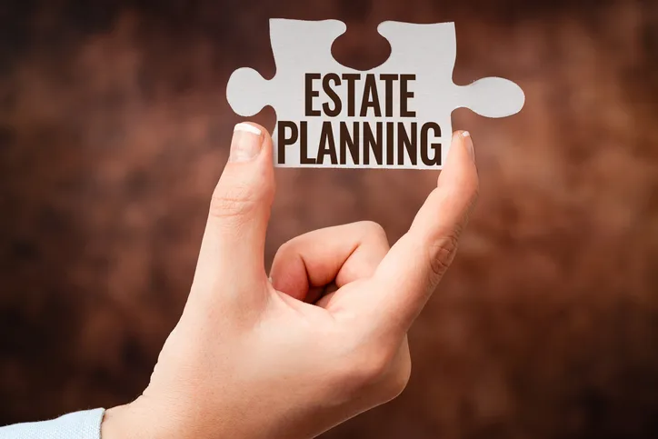 A puzzle piece with the word "estate planning" written on it.